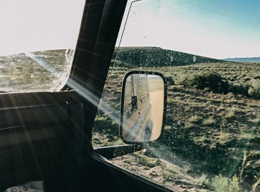 Sun shining through windshield of car