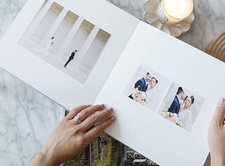 Zoomed in on interior of Artifact Uprising Layflat Photo Album featuring wedding portraits with lots of negative space on page