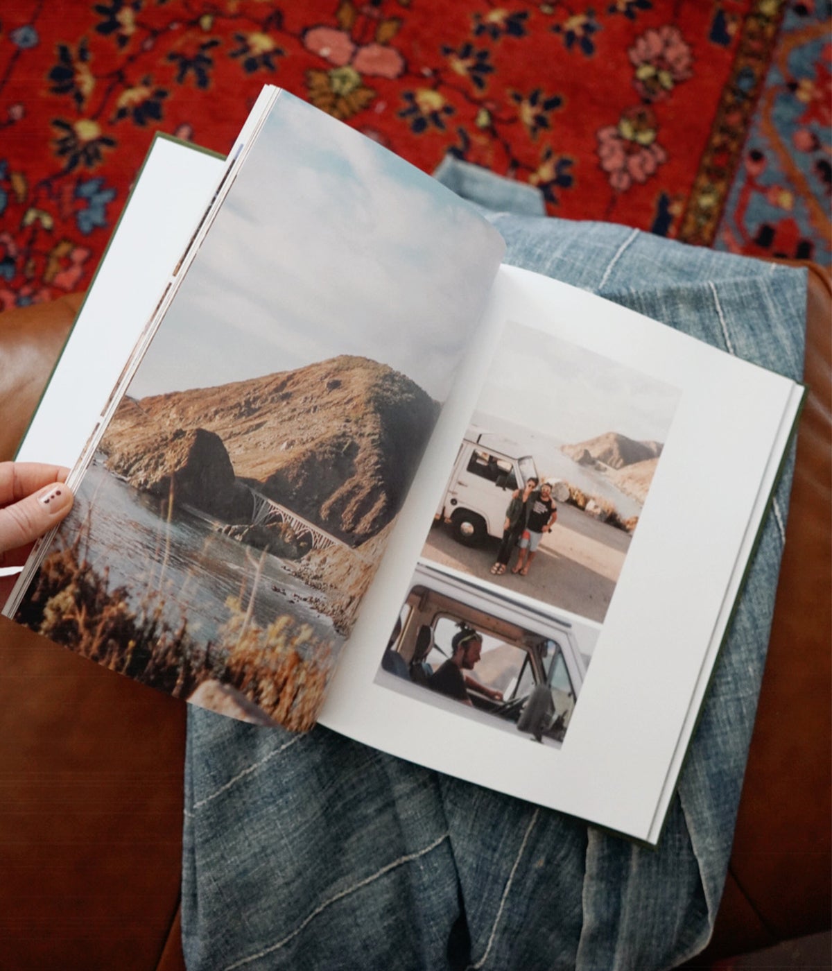 Woman's hand flipping through travel album