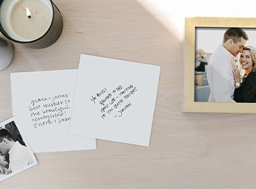 Hand writing a letter inside of a scrapbook album